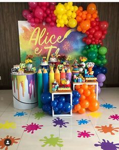 an image of a party with balloons and decorations on the floor in front of a backdrop