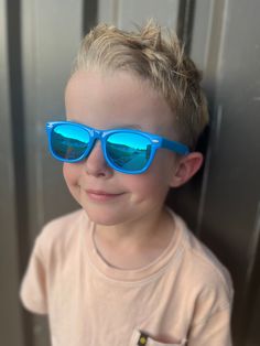 Elevate your child's style with our Blue Kids Ray-Ban Sunglasses. These iconic shades feature a sleek blue frame, reminiscent of the classic Ray-Ban design. Designed to provide both fashion and functionality, these sunglasses offer UV protection while adding a touch of cool sophistication to any outfit. Let your little one shine with confidence and timeless style, as they rock these must-have blue Ray-Ban sunglasses. Casual Blue Sunglasses For Pool, Blue Plastic Sunglasses With Uva Protection, Blue Polarized Plastic Sunglasses, Casual Light Blue Sunglasses With Uv Protection, Blue Plastic Sunglasses With Mirrored Lenses, Blue Mirrored Plastic Sunglasses, Playful Blue Sunglasses With Uv Protection, Blue Sunglasses With Uva Protection For Pool, Playful Blue Tinted Sunglasses