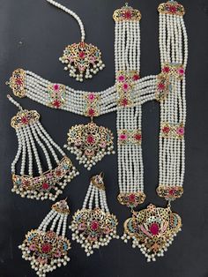 an assortment of necklaces and earrings on display