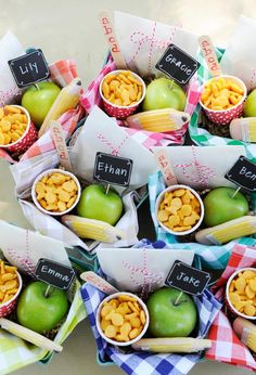 a table topped with lots of different types of fruit and snacks on top of each other