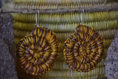 Pandanus earrings made by one of Injalak's wonderful weavers, Helen Nawirridj. These earrings use a combination of 100% local organic dyes, with subtle colour variation in the dyed Pandanus. We provide the sterling silver hooks to our weavers. In Aboriginal languages, necklaces, bracelets, earrings and other body adornments are usually named after the body part they are used for. A necklace is 'for the neck', and a bracelet is 'for the arm'. An earring is known as 'Kunkanemkenh', made up of 'kun Traditional Handwoven Brown Earrings, Traditional Brown Handwoven Earrings, Unique Handmade Spiral Earrings, Handmade Spiral Wrap Earrings, Handmade Unique Spiral Wrap Earrings, Unique Handmade Spiral Wrap Earrings, Artisan Brown Earrings For Gift, Traditional Handwoven Natural Jewelry, Traditional Handwoven Natural Color Jewelry