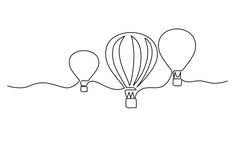 three hot air balloons floating in the sky, one is drawn with black ink on white paper