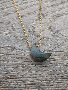 This dainty necklace features a SMALL (18mm x 7mm) crescent moon-shaped labradorite pendant. Made with a dainty hypoallergenic chain & matching components- choose from from stainless steel, gold-plated stainless steel (shown in photos), sterling silver, or gold-filled. The closure is a 10mm lobster clasp for the stainless steel options, and a 6mm spring clasp for the sterling and gold filled. All of my photos are taken in natural light.  Please note the natural variations of coloring for each pi Labradorite Moon Shaped Necklace With Moon Charm, Gold Labradorite Jewelry With Moon Charm, Labradorite Moon Charm Necklace, Gold Jewelry With Moon Charm And Labradorite, Gold Jewelry With Labradorite Moon Charm, Dainty 14k Gold Filled Crescent Necklaces, Gold Crescent Wire Wrapped Necklaces, Moon Shaped Labradorite Jewelry With Moon Charm, Labradorite Moon Charm Jewelry