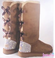 In addition to these TALL STYLE Uggs having THREE satin Bows down the back, adding a cute variation to a classic style: UGG® AUSTRALIA boot is one of the most plush, durable, and most luxurious pair of winter snow boots on the planet! OVER 1300(!!) Ultra-Premium Crystals each hand-jeweled with precision! You can get the ultimate in personal touch with your choice of crystal color! Just send us a message prior to ordering. A nominal fee may apply. These are 100% Guaranteed Authentic UGG® Bailey B Style Uggs, Bow Ugg, Bow Uggs, Uggs With Bows, Ugg Boots Australia, Bailey Bow Uggs, Custom Bling, Bow Boots, Bailey Bow