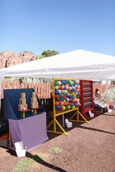 there is a tent with balloons on it