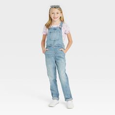 Add a cool finishing touch to your kid's wardrobe with these Overalls from Cat & Jack™. The denim overalls are made with soft and stretchy fabric in an ankle length cut for all-day comfort. Cut in a straight fit, the overalls feature an adjustable waistband for a comfy fit. Multiple pockets provide ample space to stash coins and other small items. The ankle-length overalls can be mixed and matched with her favorite tees for a quick and easy casual outfit. Cat & Jack™: Classics with an imagination of their own. Cute Overalls, Simple Casual Outfits, Girls Overalls, Black Overalls, Kids Wardrobe, Girls Denim, Adjustable Waistband, Hem Style, Denim Overalls