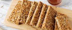 granola bars cut into squares on a cutting board