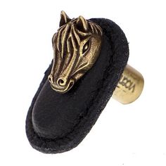 a close up of a ring with a horse head on it's side,