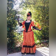 For Sale: Orange And Black Steampunk Bustle Gown. This Is A 3 Piece Dress, Bodice, Skirt, And Overskirt/Bustle. Includes The Hat And Gloves. Perfect For October/Fall/Halloween Parties! Poly Taffeta Skirt With Black Poly Taffeta Under Ruffle. Bodice Of Same Material, With Heavily Beaded Stomacher That Snaps On. Bodice Can Be Laced Underneath The Stomacher. Very Well Made, Quality Work And Nice Fit. Dress Is In New/Barely Used Or Hardly If Ever Worn Condition. Tried On For Photos Only. Gloves Have Vintage Costume For Cosplay Events, Vintage Fitted Costume For Themed Events, Fitted Vintage Costume For Themed Events, Vintage Fitted Halloween Costumes, Fitted Vintage Halloween Costumes, Vintage Halloween Costumes For Themed Events, Halloween Overbust Victorian Dress, Halloween Victorian Overbust Dress, Halloween Fancy Dress Costume With Overbust