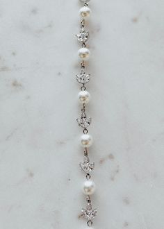 A favorite UP classic style, a stunning crystal and pearl detailed bracelet. Elegant White Crystal Pearl Bracelet, Elegant White Pearl Crystal Bracelet, Adjustable Gold-plated Pearl Bracelet For Weddings, Elegant Gold-tone Pearl Bracelet, Luxury Gold-plated Pearl Bracelet For Formal Occasions, Veil Accessories, Cross Necklace, Pearl Necklace, Classic Style