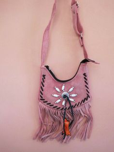 Absolutely awesome!! Made by Ameri-Mex - new with tag Genuine Ultra-soft Suede mauve or pink Leather Ladies Western Style shoulder bag with belt loop - fringed with beaded concho and leather trimmed Western style with 5 1/2 inch with 6 inch fringe, with leather accents, Bag has zipper closing and satin lined - no inside pocket Shoulder strap is totally adjustable 15 - 19 inches 1 inch gusset Bag is 7 inches wide, 5 1/2 - 6 inches high with 1 inch gusset bag has a belt loop on back so can be work Gusset Bag, Leather Accents, Leather Work, Pink Leather, Western Style, Soft Suede, Leather Working, Western Fashion, Leather Trims