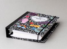 a black and white book with hearts on it