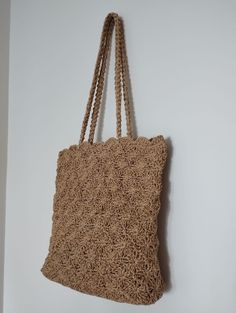 The perfect blend of elegance and practicality with our Handcrafted Crochet Straw Bag. This stylish accessory combines durable straw with intricate crochet detailing, offering a unique and sophisticated look. Spacious enough for your essentials, it's perfect for beach outings, casual brunches, and beyond. Elevate your style with a touch of handmade charm! Elegant Square Straw Bag For Vacation, Woven Straw Pouch Bag For Shopping, Beige Pouch Straw Bag For Beach, Beige Straw Pouch Bag For Beach, Beige Pouch Straw Bag For The Beach, Everyday Use Straw Pouch Bag, Elegant Beige Crochet Bag With Natural Fiber, Rectangular Sand-colored Straw Bag, Rectangular Sand-colored Jute Straw Bag