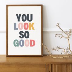 an art print with the words you look so good in multi - colored letters on it