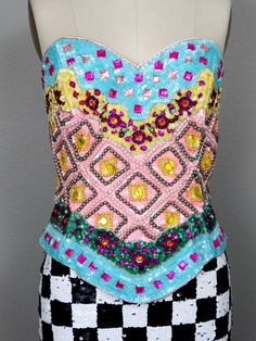 "This is a an absolutely gorgeous vintage embellished strapless top by Julie Duroche - After Five. It's beautifully detailed with multicolored jewels, beads and sequins. It's in excellent condition! Bust - 34\" Waist - 27\" Length - 15\" Tag Size - 10 (fits smaller, please refer to measurements) This item comes from a pet-free and smoke-free home. If you would like more info or have any questions, please don't hesitate to ask!" Sequin Sleeveless Fitted Bodice Corset, Elegant Embellished Summer Corset, Elegant Summer Embellished Corset, Glamorous Embellished Strapless Corset, Glamorous Strapless Sequined Corset, Strapless Embellished Evening Corset, Embellished Fitted Corset For Summer, Summer Embellished Fitted Corset, Embellished Fitted Summer Corset