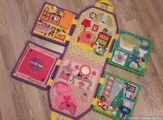 several pieces of children's play mat laid out on the floor with handles and pegs