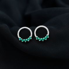 Product Details Elevate your elegance with our Open Circle Stud Earrings, adorned with petite Round Shape Emerald Gemstones and Diamonds. These exquisite earrings effortlessly combine the allure of emeralds with the brilliance of diamonds, creating a captivating accessory that adds a touch of sophistication to any ensemble. Product Information SKU SHP-EARRINGS072018775 Length 12 mm Width 11.3 mm Height 1.5 mm Weight 1.40 gm (Approximate) EMERALD INFORMATION No.of Stones 10 Pieces Total Weight 0. Circle Stud Earrings, Circle Earrings Studs, Circle Studs, Emerald Earrings, Emerald Gemstone, Round Shape, Prong Setting, Gold Metal, Solid Gold