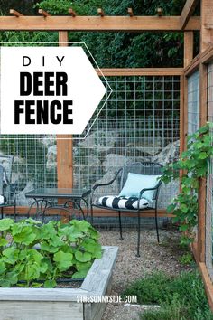 a diy deer fence in the garden with chairs and tables around it, surrounded by greenery