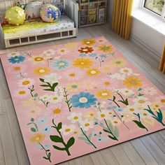 a pink rug with flowers on it in a child's room