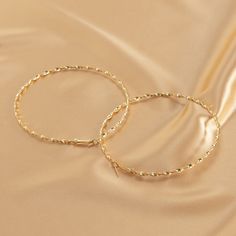 Be bold with your accessories and decorate your side profile with this pair of goldtone hoops boasting a large twisted design. 3.15'' diameter Goldtone copper 14k Gold Plated Jewelry, Twisted Hoop Earrings, Side Profile, Be Bold, Cool Gifts, Vintage Stil, Wedding Jewelry, Gold Bracelet, 18k Gold