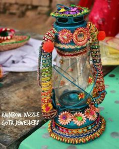 a colorful lantern is sitting on a table