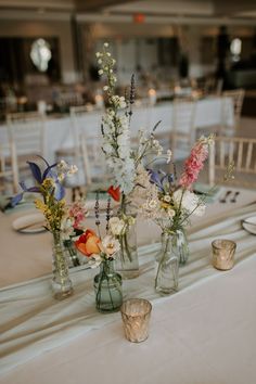 The soft white Ballroom was filled with lush blooms, bud vases and lots of candles- the perfect gardenesque reception! Love Is In Bloom Table Decor, Vases With Flowers, Wildflower Baby Shower, Wedding Tables, 2024 Wedding, Colorful Wedding, Wedding Mood