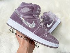 Bling Air Jordan 1 Mid Shoes Hand Customized with Genuine Swarovski Crystals Colors: Purple Velvet w/ White Soles Model and Color Code: #DQ8397-500 Note: Box may be missing top lid or shoe box Each and every Swarovski crystal is set by hand with top quality, permanent adhesive. Our products come direct from the manufacturer or authorized retailers, and are 100% authentic. We offer free crystal replacement for life! Should any crystals fall off, simply send your shoes back to us and we'll fix them for only the cost of shipping! Here are some other options you might like: https://etsy.me/2O6KIZp https://etsy.me/33Hy21z https://etsy.me/34XSbAN https://etsy.me/2pjfnug Rosa Jordans, Bling Nike, Pinterest Room, Pink Jordans, Ball Shoes, Mid Shoes, Pretty Sneakers, Velvet Sneakers, Custom Bling