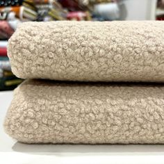 two rolled up towels sitting on top of each other