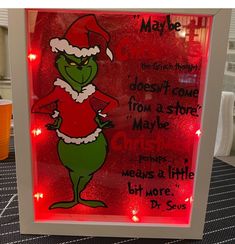 a lighted sign with an image of dr seuss on it