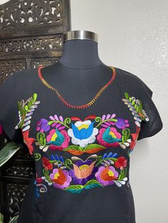 "Beautiful hand embroidered dress! This has been made and brought directly from Chiapas, Mexico. The embroidery is 100% handcrafted. All the work on this dress has a professional skilled finish and the multicolor embroidered makes it look even more eye catching. The embroidery work is made with great quality thread. The eye catching will be on the embroidered work, which is exquisite looking. Beautiful and clean work! Very light weight and fresh looking. SINCE THESE ARE EACH HANDMADE, EMBROIDERY Folk Style Embroidered Dress With Multicolor Hem, Folk Style Multicolor Embroidered Dress, Folk Style Dress With Geometric Embroidery, Multicolor Cotton Dress With Floral Embroidery, Multicolor Cotton Embroidered Dress With Floral Details, Multicolor Cotton Dress With Embroidered Neckline, Traditional Floral Embroidered Dress For Fiesta, Folk Multicolor Embroidered Dress For Fiesta, Folk Style Multicolor Embroidered Dress For Fiesta