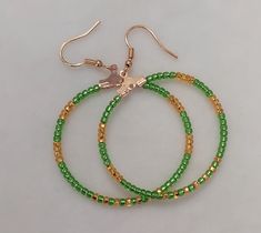 Beaded Hoop Earrings 10/0 Seed Beads Made in Czech Republic. Fish Hook is 14K Gold Plated, Brass Base and Nickel free. Hoop is Nickel Free Iron. Green Hoop Beaded Earrings, Green Hoop Earrings With Dangling Beads, Green Small Hoop Beaded Earrings With Tiny Beads, Hoop Beaded Earrings With Spacer Beads, Green Hoop Earrings With Colorful Beads, Green Hoop Earrings With Tiny Beads, Green Small Hoop Earrings With Tiny Beads, Green Beaded Hoop Earrings, Earrings Golden