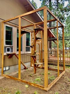 a chicken coop in front of a house