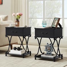 two black end tables with drawers on each side in front of a couch and window