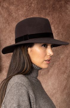 A velvet band encircles this wool fedora, enhancing its modern, chic attitude. 100% wool Spot clean Imported Brown Fedora, Sleek Dress, Wool Fedora, Felt Fedora, Everyday Chic, Bold Jewelry, Eugenia Kim, Fedora Hat, Velvet Ribbon