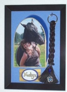 a photo frame with a horse and a keychain hanging from it's side