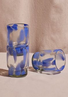 Stackable recycled glass tumblers with large periwinkle speckle pattern. Hand Blown Glass Cups, Cute Dishware, Simply Modern Tumbler, Stackable Glassware, Rainbow Glassware, Apartment Gifts, Colorful Plates, Miami Apartment, Retro Glassware