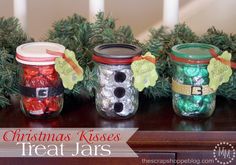 christmas kisses treat jars are lined up on a table