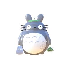 an image of a totoro with its eyes open and two smaller ones behind it