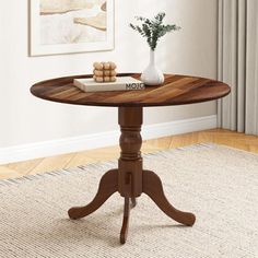 a wooden table sitting on top of a carpeted floor next to a vase filled with flowers