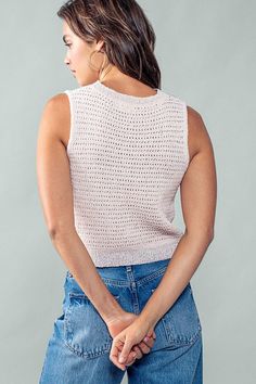 Unleash your inner style with our chic Checkmate top. This sleeveless crochet knit top features a delicate pink and lavender checkered pattern, adding a touch of elegance to any outfit. Perfect for the fashion-forward individual looking for a luxurious and exclusive addition to their wardrobe. 40% Polyester, 40% Acrylic, 20% Rayon See size chart for size details Some stretch Spring Sleeveless Pointelle Knit Top, Chic Pointelle Knit Sleeveless Sweater Vest, Chic Pointelle Knit Sweater Vest, Trendy Open Knit Sweater Vest For Spring, Sleeveless Crochet Top With Textured Knit For Spring, Chic Sleeveless Crochet Top With Textured Knit, Spring Sleeveless Textured Knit Top, Sleeveless Textured Knit Tops For Spring, Chic Sleeveless Pink Knit Top