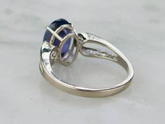 The curved and yet simplistic style of this mounting creates a wonderful sense of balance in this ring, echoing the cut of the tanzanite we've set at the center. This is set relatively low on the finger and is comfortable on the hand, easy to transition from day to evening. Metal: 14 Karat White Gold Center Stone: Tanzanite, 11 x 8 mm Oval, 3.32 carats Size of Ring: 6 3/4, but can be sized to fit almost any finger (please see our sizing policies for more information). Marks: 14K Stamped on the i Tanzanite Engagement Ring, Simplistic Style, Tanzanite Ring, Minimalist Modern, Eternity Bands, Modern Minimalist, Sense, Wedding Rings, Gems