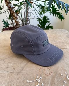 Charcoal Gray Organic Canvas 5-panel Trucker Hat For Outdoor Activities, Adjustable Gray Baseball Cap For Outdoor Activities, Adjustable Gray Baseball Cap For Outdoor, Adjustable 5-panel Baseball Cap For Outdoor, Adjustable 5-panel Outdoor Baseball Cap, Casual Gray Snapback Hat For Outdoor, Adjustable Outdoor 5-panel Baseball Cap, Gray Adjustable Hat For Camping, Adjustable Gray Hat For Camping