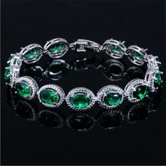 Simulated Emerald Stamped 925 Sterling Silver Bracelet. Made With Top Grade Cubic Zirconia That Is Cut To Shine Like Real Diamonds And Gemstones. Each Stone Has A Lot Of Depth And Sparkle. Bracelet Measures Approximately 7” Inches And Comes With A 1” Inch Extender Clasp. This Is A Beautiful Quality Bracelet! Brand New Condition And Comes In A Gift Box. Metal Type ~ Stamped 925 Sterling Silver Gemstone Type ~ Cubic Zirconia Bundle & Save: Bundle 2 Or More Items For A Private Discount Next Day Shi Green Cubic Zirconia Crystal Bracelet, Silver Tennis Bracelet With Gemstones, Texture Metal, Cubic Zirconia Bracelet, Rhinestone Bridal, Bangle Bracelets With Charms, Bridal Bracelet, Green Emerald, Wedding Jewelry Sets