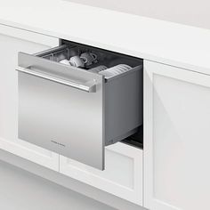 a stainless steel dishwasher is open in a kitchen with white cabinets and drawers