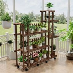 a wooden shelf filled with potted plants on top of a hard wood floored porch