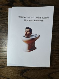 a birthday card with an image of a man's head on top of a toilet