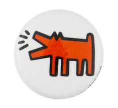 a button with an orange dog on it