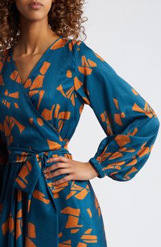 Organic abstract shapes enliven the jacquard fabric of this lightweight wrap dress inspired by traditional West African styles. Each piece is designed for longevity. Every garment is made-to-order to reduce production waste. Surplice V-neck Long sleeves 100% polyester Machine wash, dry flat Made in Senegal Black Owned/Founded True Autumn, 2024 Dresses, Modern Kebaya, Organic Abstract, African Styles, Print Shirt Dress, Long Sleeve Wrap Dress, Dressed To The Nines, Printed Wrap Dresses