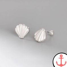 Sterling Silver Shell Earrings: A Must-Have for Sea Lovers Are you a passionate lover of the sea, mesmerized by its enchanting beauty and alluring symbols? If so, our Sterling Silver Shell Earrings are the perfect accessory for you! Crafted with love and attention to detail, these earrings are a celebration of marine life and the nautical world. The Shell Earrings collection, available here, represents our dedication to providing nautical jewelry that captures the essence of the sea. These earri Silver Ocean-inspired Earrings, Silver Ocean-inspired Earrings For Gifts, Silver Shell-shaped Pearl Earrings For Gifts, Elegant Hypoallergenic Earrings For Beach, Adjustable Silver Shell-shaped Earrings, Ocean-inspired Sterling Silver Drop Earrings, Sterling Silver Beach Earrings, Casual Beach Wear, Sea Lover