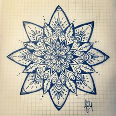 a drawing of a blue and white flower on a piece of paper with graph paper in the background